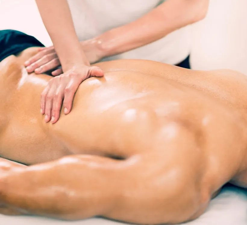 Deep tissue sports massage on a man's back