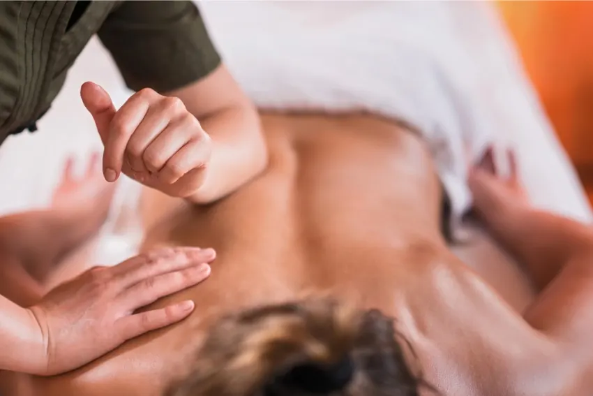 Deep tissue sports massage on a man's back